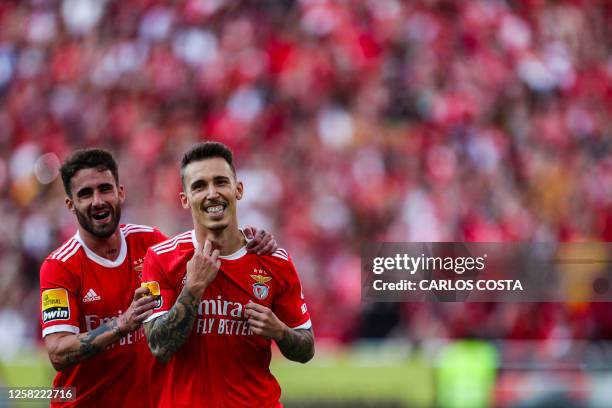 Benfica's Spanish midfielder Alex Grimaldo celebrates with Benfica's Portuguese midfielder Rafa Silva after scoring a goal during the Portuguese...