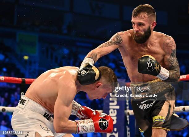 Belfast , United Kingdom - 27 May 2023; Anthony Cacace, right, in action against Damian Wrzesinski during their IBO World Super-Featherweight title...