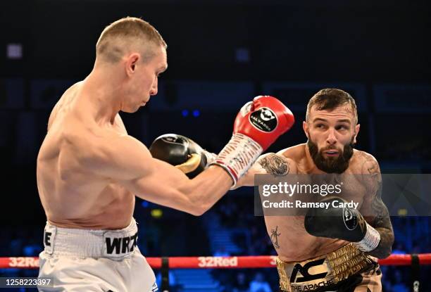 Belfast , United Kingdom - 27 May 2023; Anthony Cacace, right, in action against Damian Wrzesinski during their IBO World Super-Featherweight title...