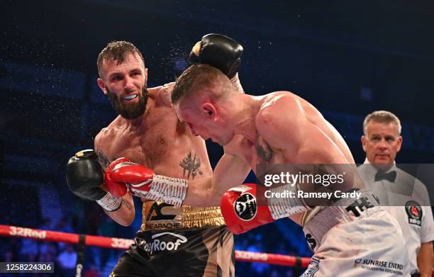 Belfast , United Kingdom - 27 May 2023; Anthony Cacace, left, in action against Damian Wrzesinski during their IBO World Super-Featherweight title...