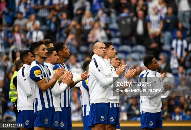 Porto's players applaud supporters at the end of the Portuguese league football match between FC Porto and Vitoria Guimaraes SC at the Dragao stadium...