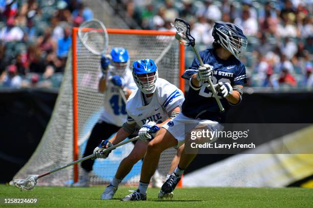 Will Frisoli of the Duke University Blue Devils defends against Matt Traynor of the Penn State Nittany Lions during the Division I Men's Lacrosse...