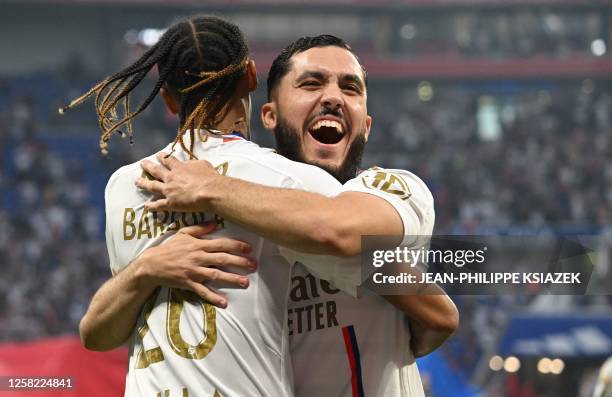 Lyon's French forward Bradley Barcola and Lyon's French midfielder Rayan Cherki celebrate after their team scored during the French L1 football match...