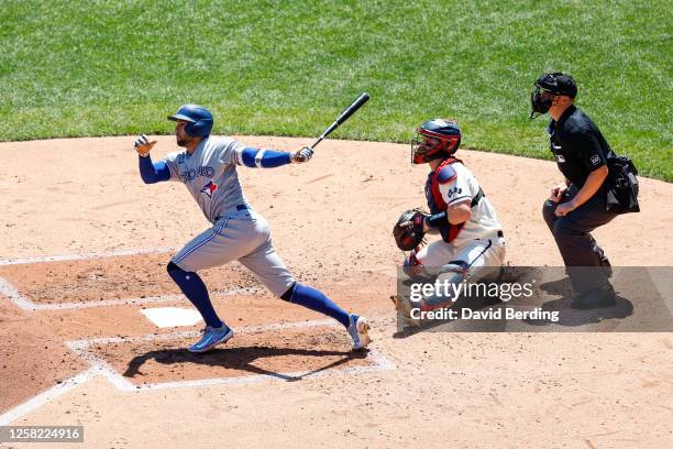 George Springer of the Toronto Blue Jays hits a single against the Minnesota Twins in the third inning at Target Field on May 27, 2023 in...