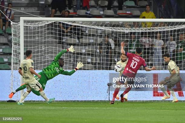 Clermont-Ferrand's Tunisian midfielder Saif-Eddine Khaoui shoots the ball past Lorient's Swiss goalkeeper Yvon Mvogo to score the opening goal during...