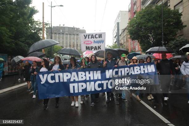 People march during a protest held against violence in Serbian society following two mass shootings in Belgrade, Serbia, on May 27, 2023. Tens of...