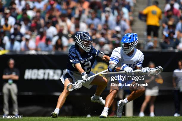 Grant Haus of the Penn State Nittany Lions defends Owen Caputo of the Duke University Blue Devils during the Division I Men's Lacrosse Semifinals...