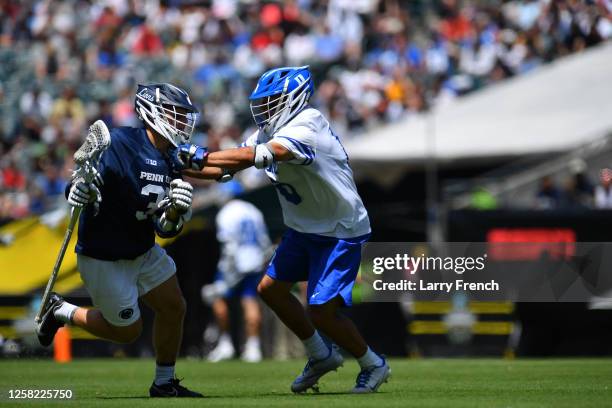 Jake Morin of the Penn State Nittany Lions runs with the ball while Jake Caputo of the Duke University Blue Devils defends during the Division I...