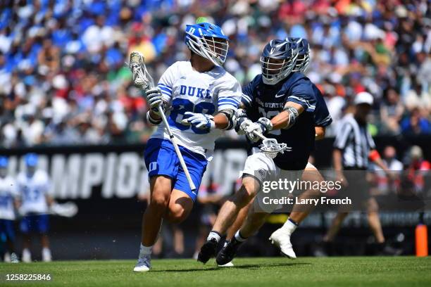 Aidan Danenza of the Duke University Blue Devils charges with the ball while Matt Traynor of the Penn State Nittany Lions defends during the Division...