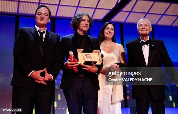 British director Jonathan Glazer stands on stage with US director Quentin Tarantino and US film director and producer Roger Corman and his daughter...