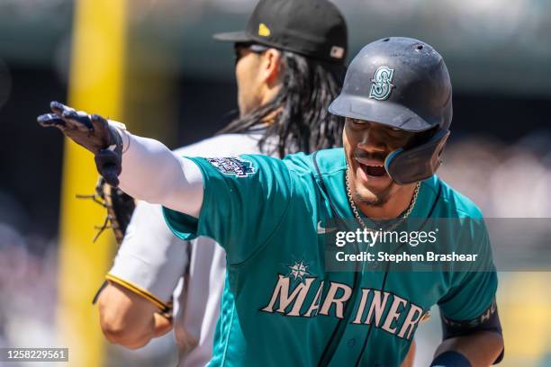 Julio Rodriguez of the Seattle Mariners celebrates after hititng a single during the seventh inning of a game against the Pittsburgh Pirates at...