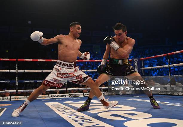 Michael Conlan is punched by Luis Alberto Lopez during their IBF world featherweight title fight at The SSE Arena Belfast on May 27, 2023 in Belfast,...