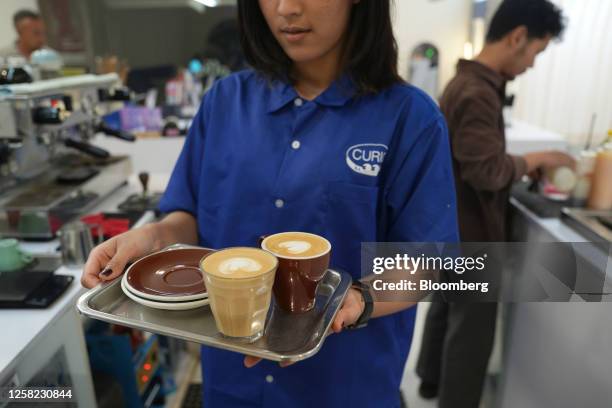 Barista serves coffee at a cafe in Sumedang regency, West Java Indonesia, on Friday, May 27, 2023. The International Coffee Organization expects...