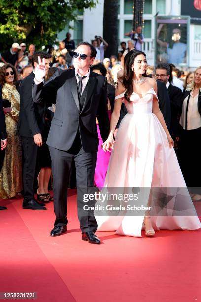 Quentin Tarantino and Daniella Pick attend the "Elemental" screening and closing ceremony red carpet during the 76th annual Cannes film festival at...