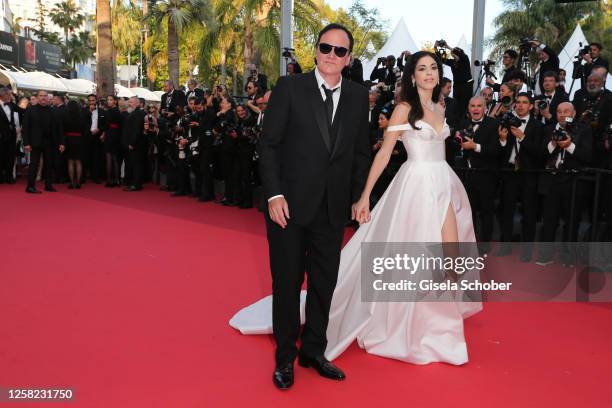 Quentin Tarantino and Daniella Pick attend the "Elemental" screening and closing ceremony red carpet during the 76th annual Cannes film festival at...