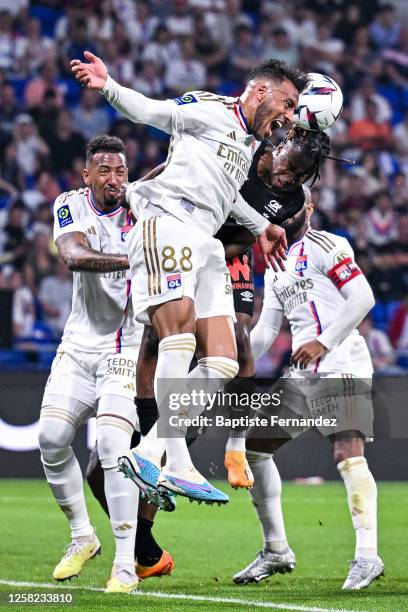 Corentin TOLISSO of Lyon and Valentin ATANGANA EDOA of Reims during the French Ligue 1 Uber Eats soccer match between Lyon and Reims at Groupama...