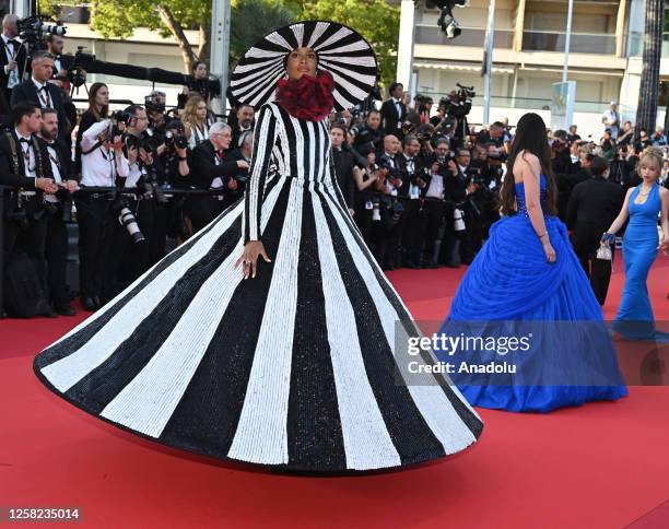 British model Ikram Abdi Omar arrives for the Closing Ceremony and the screening of the film "Elemental" during the 76th Cannes Film Festival at...