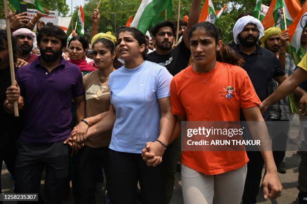 Indian wrestlers Bajrang Punia , Vinesh Phogat , Sakshi Malik and Sangeeta Phogat attempt to march to India's new parliament, just as it was being...