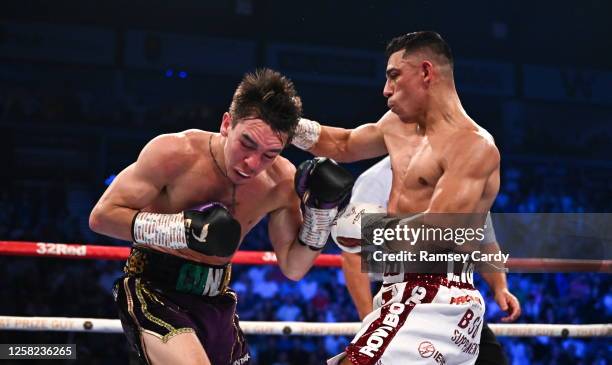 Belfast , United Kingdom - 27 May 2023; Luis Alberto Lopez, right, in action against Michael Conlan during their IBF Featherweight World Title bout...