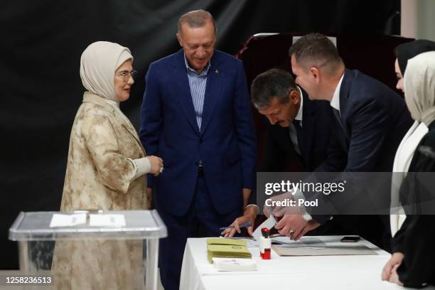 Turkish President Recep Tayyip Erdogan and his wife Emine Erdogan cast their vote during the Turkish presidential election runoff on May 28, 2023 in...