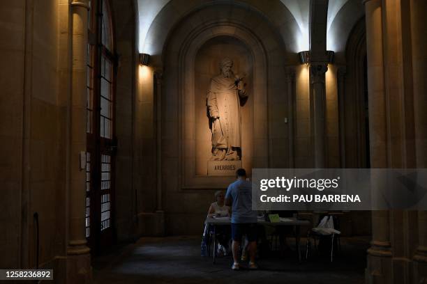 Voter casts his ballot at a polling station in the University of Barcelona, on May 28, 2023 during local and regional polls. Spain's local and...