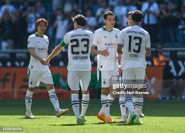 Florian Neuhaus of Borussia Moenchengladbach congratulates Lars Stindl of Borussia Moenchengladbach for his last game played during the Bundesliga...