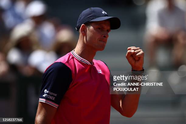 Poland's Hubert Hurkacz reacts as he plays against Belgium's David Goffin during their men's singles match on day one of the Roland-Garros Open...