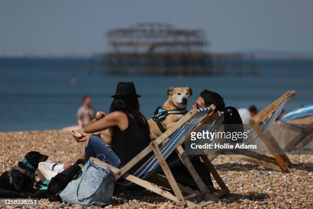 People enjoy the hot weather at Brighton beach on May 28, 2023 in Brighton, England. The UK is set to experience the hottest days of the year over...