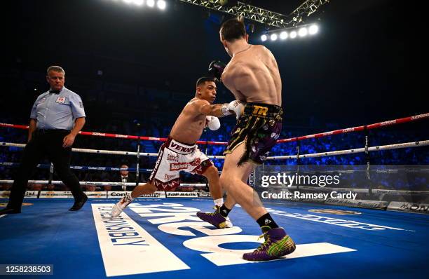 Belfast , United Kingdom - 27 May 2023; Luis Alberto Lopez, left, in action against Michael Conlan during their IBF Featherweight World Title bout...