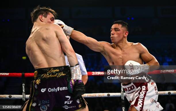 Belfast , United Kingdom - 27 May 2023; Luis Alberto Lopez, right, in action against Michael Conlan during their IBF Featherweight World Title bout...