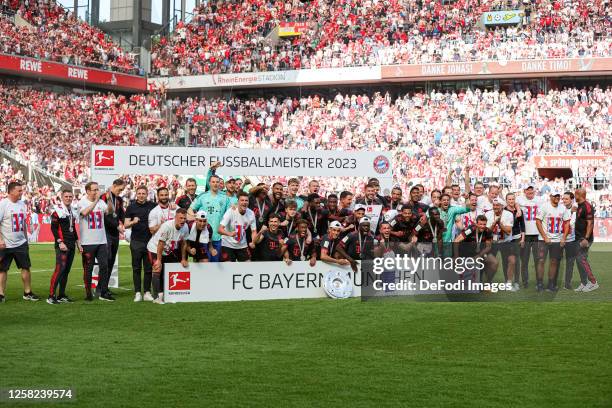 Players of FC Bayern Muenchen celebrate the championship after the Bundesliga match between 1. FC Köln and FC Bayern München at RheinEnergieStadion...