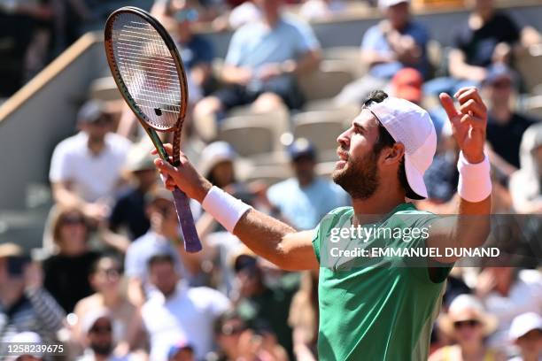 Russia's Karen Khachanov celebrates after victory against France's Constant Lestienne during their men's singles match on day one of the...