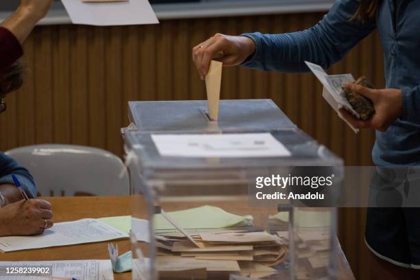 Citizen casts her vote for the municipal elections, where the future mayors for the next 4 years will be elected, in San Sebastian, Spain on May 28,...