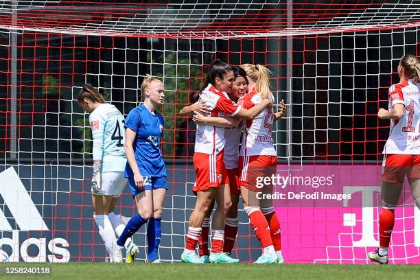 Jovana Damnjanovic of Bayern Muenchen celebrates after scoring her team's fourth goal with teammates during the FLYERALARM Women's National League...