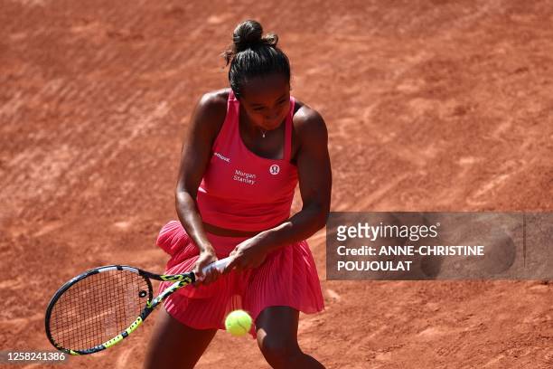 Canada's Leylah Fernandez returns the ball to Poland's Magda Linette during their women's singles match on day one of the Roland-Garros Open tennis...