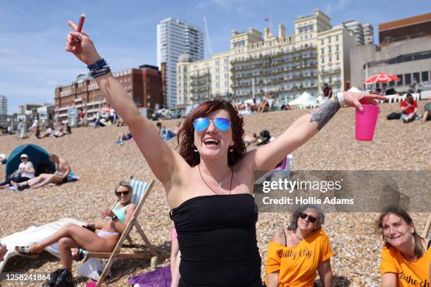 Kerri, from Scotland, enjoying the hot weather during a 'Hen' party at Brighton beach on May 28, 2023 in Brighton, England. The UK is set to...