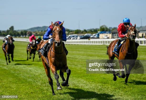 Kildare , Ireland - 28 May 2023; Luxembourg, with Ryan Moore up, left, on their way to winning the Tattersalls Gold cup ahead of eventual second, Bay...