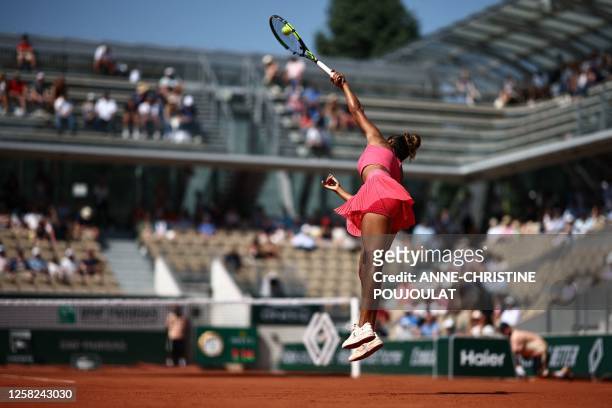 Canada's Leylah Fernandez serves to Poland's Magda Linette during their women's singles match on day one of the Roland-Garros Open tennis tournament...
