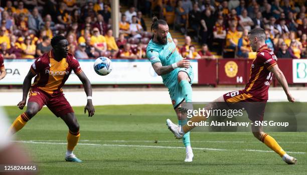 Motherwell's Bevis Mugabi is judged to have handled the ball from Dundee Utd's Steven Fletcher's shot during a cinch Premiership match between...