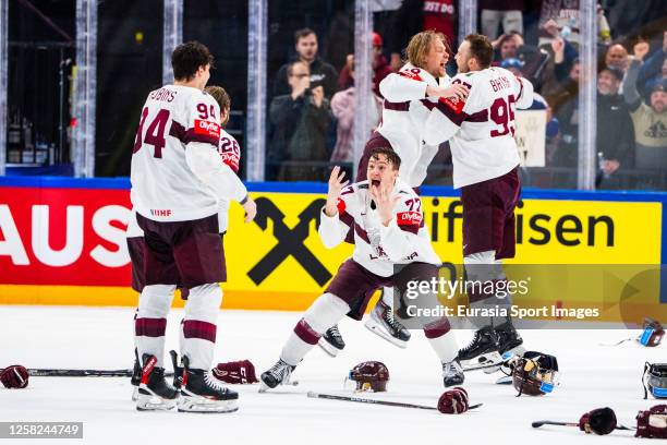 Kristaps Roberts Zile of Latvia celebrates the bronze medal with Kristians Rubins of Latvia during the 2023 IIHF Ice Hockey World Championship...