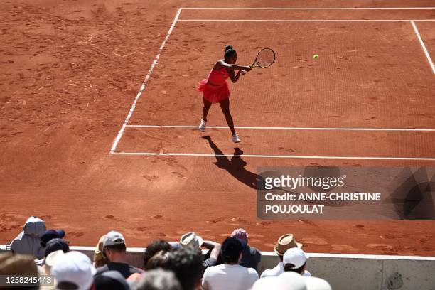 Canada's Leylah Fernandez plays a backhand return to Poland's Magda Linette during their women's singles match on day one of the Roland-Garros Open...