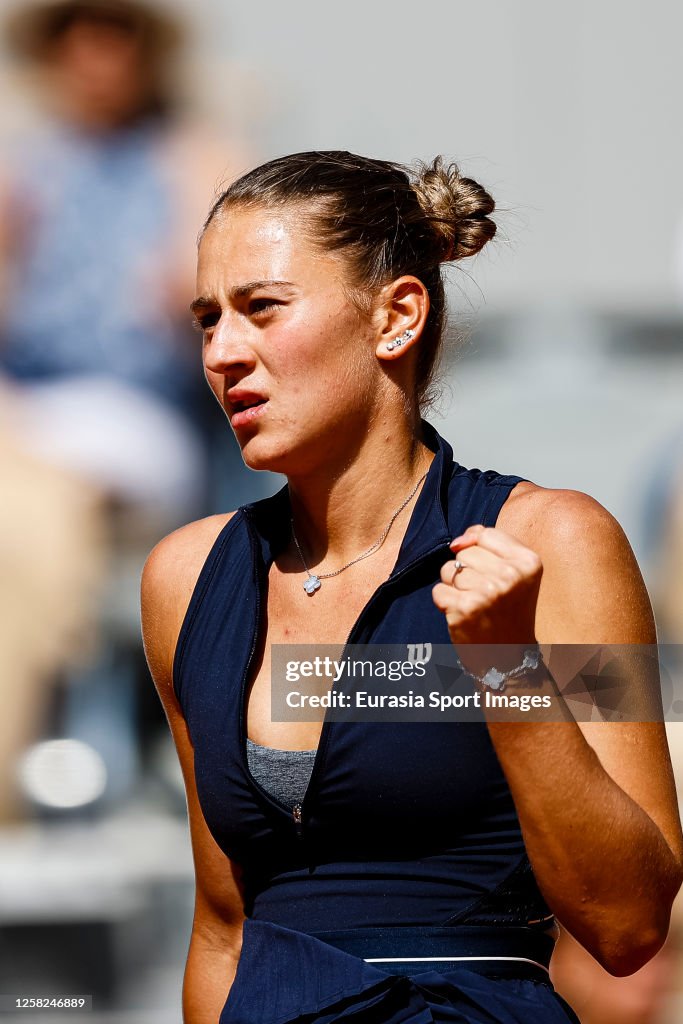 Marta Kostyuk of Ukraine celebrates a set won against Aryna Sabalenka