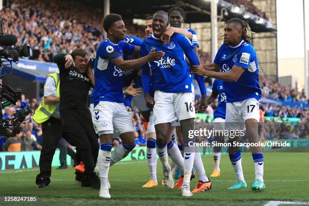 Abdoulaye Doucoure of Everton celebrates with James Garner after scoring the opening goal and Demari Gray during the Premier League match between...
