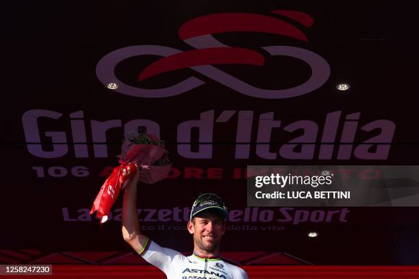 Astana Qazaqstan Team's British rider Mark Cavendish celebrates on the podium after winning the twenty-first and last stage of the Giro d'Italia 2023...