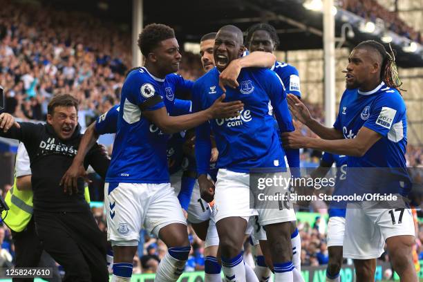 Abdoulaye Doucoure of Everton celebrates with James Garner after scoring the opening goal and Demari Gray during the Premier League match between...