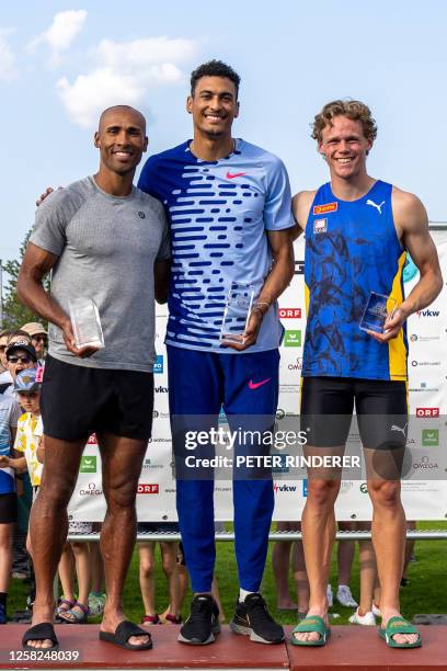 Second placed Lindon Damian Warner of Canada, winner Pierce Lepage of Canada and third placed Sander Skotheim of Norway pose on the podium at the...