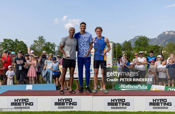Second placed Lindon Damian Warner of Canada, winner Pierce Lepage of Canada and third placed Sander Skotheim of Norway pose on the podium at the...