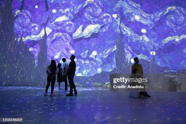 Visitors view the 'Van Gogh 360' Immersive Light and Shadow Exhibition in Gurugram, on the outskirts of New Delhi, India on May 28, 2023. The...