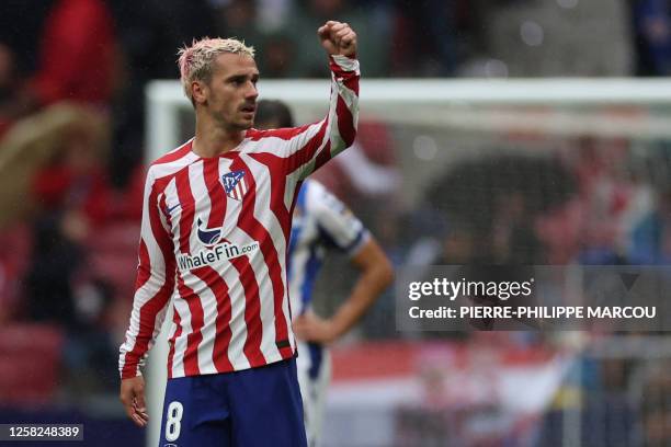 Atletico Madrid's French forward Antoine Griezmann celebrates scoring the opening goal during the Spanish league football match between Club Atletico...
