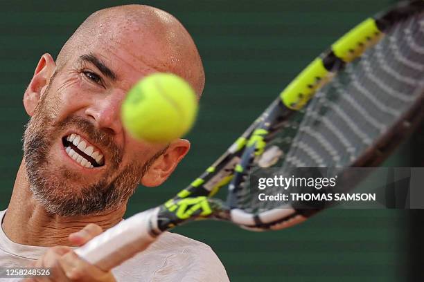 France's Adrian Mannarino eyes the ball as he plays against France's Ugo Humbert during their men's singles match on day one of the Roland-Garros...